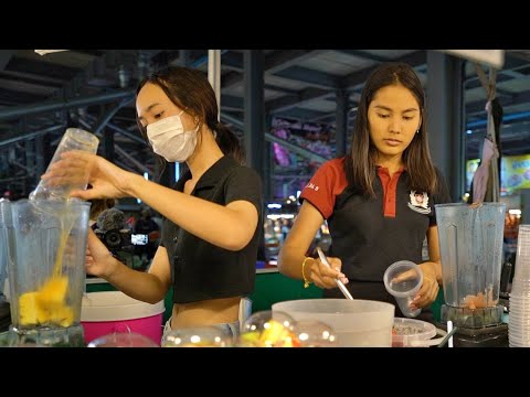 Young and Pretty Pattaya Girls make delicious fruit juices in Thepprasit night market.